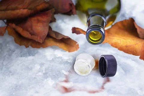 Empty cognac bottle with two caps Stock Photos