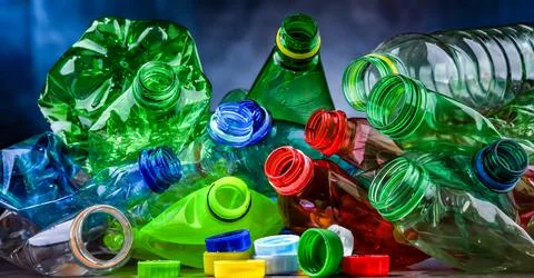 Empty colored drink bottles. Recyclable plastic waste. Stock Photos
