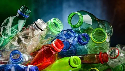 Empty colored drink bottles. Recyclable plastic waste. Stock Photos