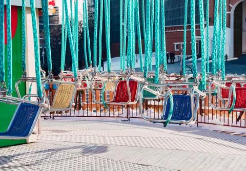 Empty colored seats of carousel Stock Photos