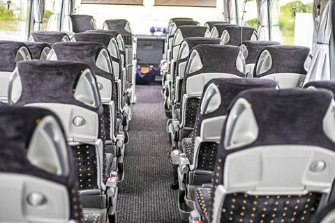 The empty, comfortable interior of a long-distance bus Stock Photos