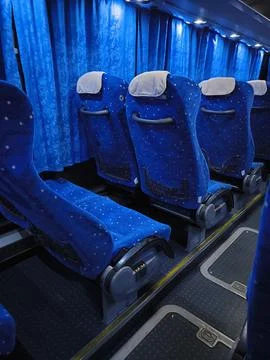 Empty comfortable seats inside a blue tourist bus 스톡 사진