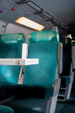 Empty comfortable seats inside a commercial train Stock Photos