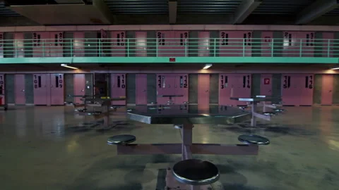 Empty common room with pink cells in a female prison Stock Footage 331603288