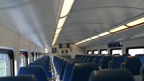 Empty Commuter Train Cabin With Rows of Blue Seats Handheld View Vídeos de archivo 297404149