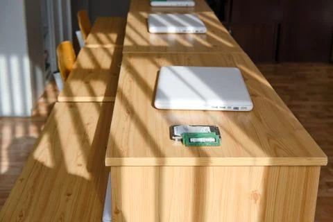An empty computer science class and laptops are lying on the desks Stock Photos