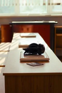 Empty computer science class, headphones and laptops are lying on the desks Stock Photos