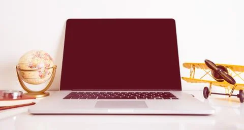 Empty computer screen with vintage travel object for travel mock up Stock Photos