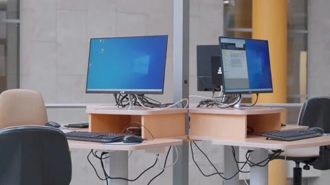 Empty computer workstations in modern office or library Stock Footage 324721363