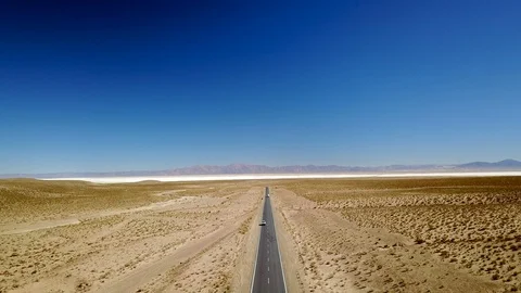 Empty concrete road on desert with blue sky Stock Footage 88417859