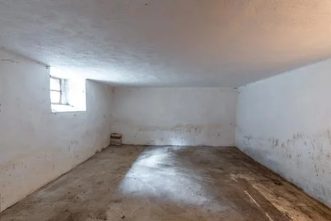Empty concrete room showing isolation and damp conditions Stock Photos