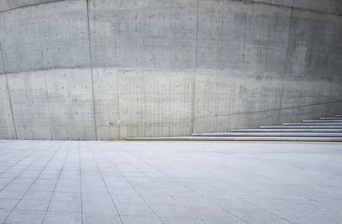Empty concrete square with steps and curved wall Stock Photos
