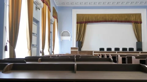 Empty conference hall with presidium table, tribune, rows of chairs and desks Stock Footage 101091049