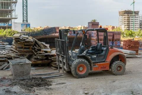 Empty construction site due to COVID-19 pandemic. Parked forklift Foto stock