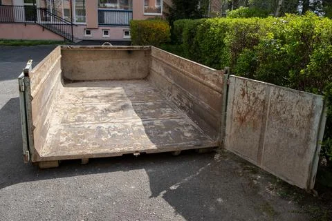An empty construction waste container ready for materials from a building d.. Stock Photos