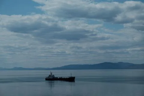 Empty container cargo ship in the blue sea. Aerial view Stock Photos