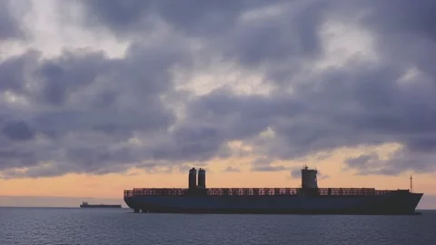 Empty container ship Maersk sails on violet sea timelapse Stock Footage 146325003