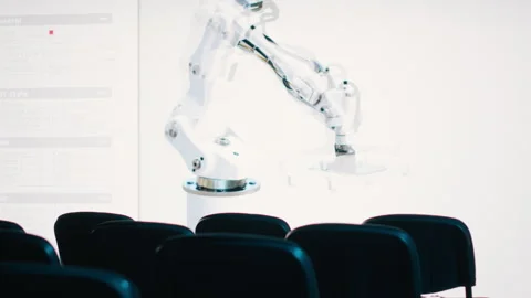 Empty convention space with chairs to present a robot arm Stock Footage 327822563