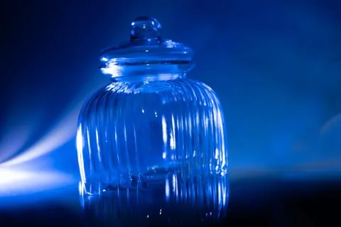 Empty cookie jar on a blue background Stock Photos