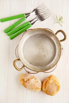 Empty cookware. fresh bread. little buns. Italian lunch. small frying pan, .. Stock Photos