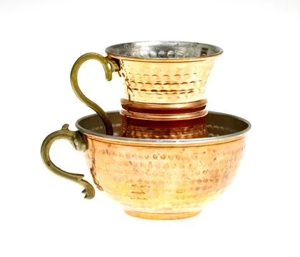 Empty copper cup isolated on white background. Stock Photos