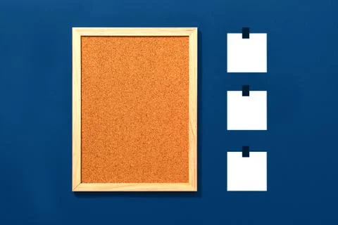 Empty cork board with blank notes on red background Stock Photos