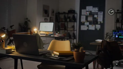 Empty Corporate Office Workspace Depicting Overtime Work at Night Stock Footage 338412573