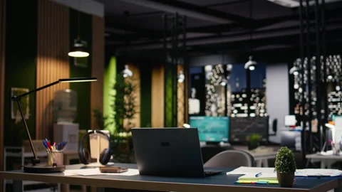 Empty corporate workspace with stylish office design illuminated by city lights Stock Footage 334043773