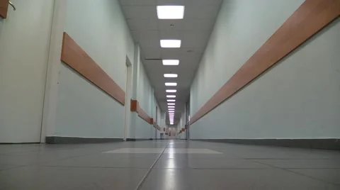 Empty corridor of a building with electric lamps lighting Stock Footage 54892979