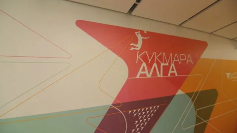 Empty corridor with colorful pattern and motivational slogan Stock Footage 230233415