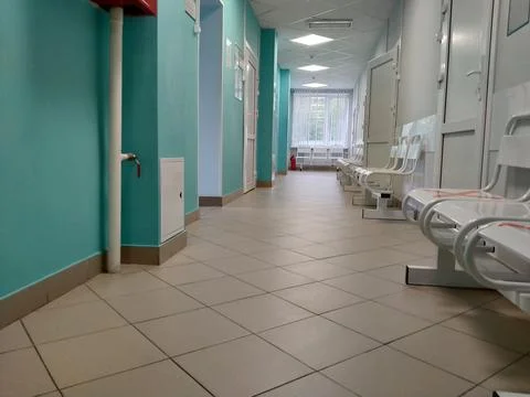 An empty corridor in a Russian clinic. The concept of the uselessness of medi Stock Photos