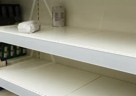 Empty counters. Retail store equipment. Close-up of empty shelf. 写真素材