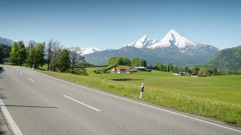 Empty country road running through scenic alpine landscape in summer Stock Footage 108618516