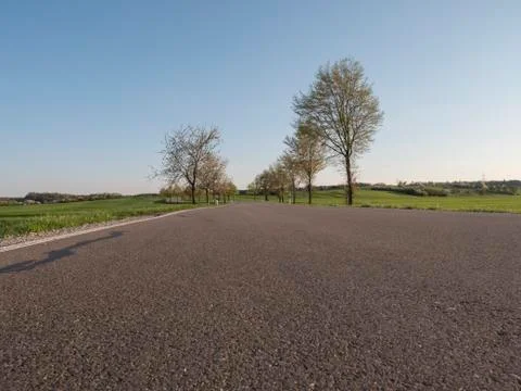 Empty countryside rural road in spring season background Stock Photos