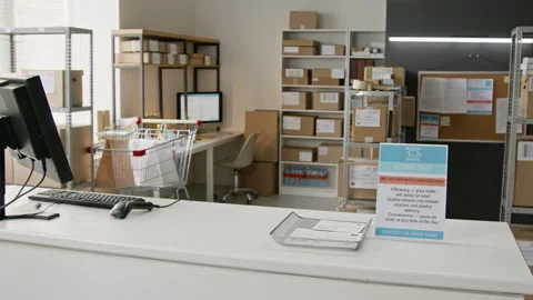 Empty Courier Delivery Office Showing Service Desk with Parcels Stock Footage 346051650