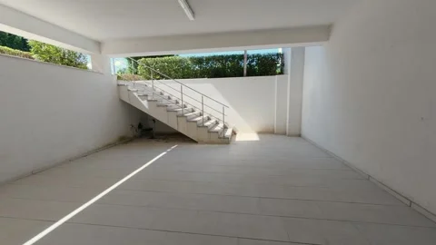 Empty Covered Modern Carport and Parking Space with Concrete Stairs Outside Stock Footage 346695275