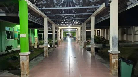 Empty Covered Walkway Hallway with Pillars in Hospital at Night Stock Photos