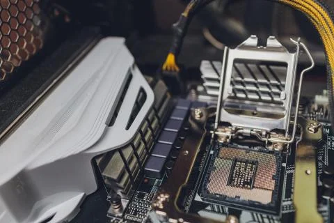 Empty cpu processor socket on a computer motherboard with pins visible. Stock Photos