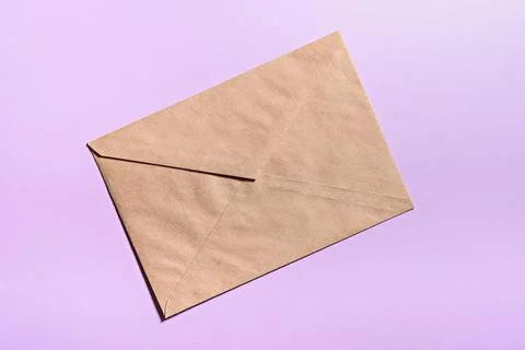 Empty craft envelope on pink background, template, mockup Stock Photos