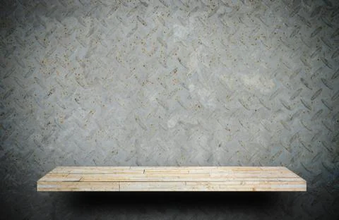 Empty Creamy stone shelf on rustic metal wall for product display Stock Photos