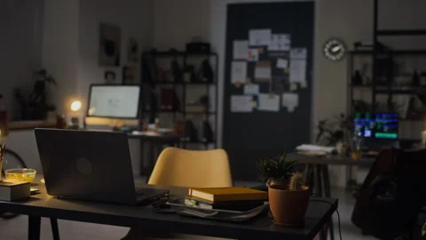Empty Creative Office Workspace Representing Overtime Work at Night 動画素材 338413954