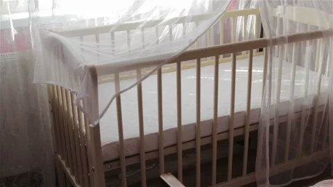 An empty crib for infants Vídeos de archivo 96680685