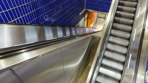 Empty crisscross ecalators stairs going up and down in subway station Stock Footage 135911234