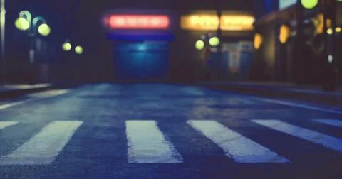 Empty crosswalk on a dimly lit street at night in an urban area Stock Illustration