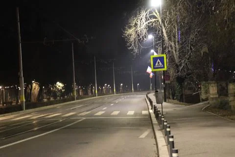 Empty crosswalk during night time Stock Photos