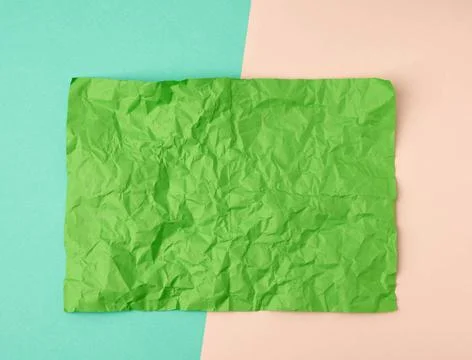 Empty crumpled green rectangular sheet of paper a4 on a color background e... Stock Photos