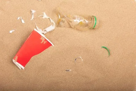 Empty Crumpled  plastic bottle abandoned on the beach Stock Photos