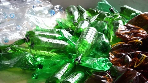 Empty crushed clear green brown plastic bottles Stock Footage 325727194