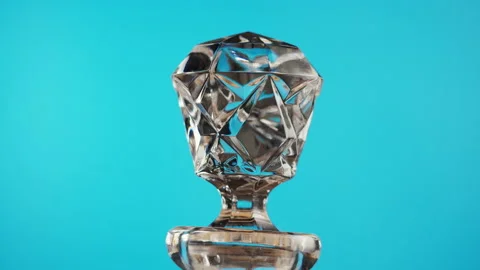 Empty crystal decanter close-up. Clear trancparent carafe rotating on blue Stock Footage 199471415