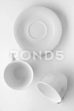 Empty cup and saucer mockup on white background, flatlay Stock Photos